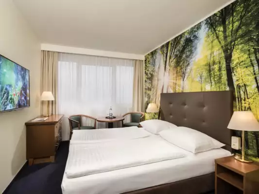 Ein Zimmer im AHORN Hotel am Fichtelberg